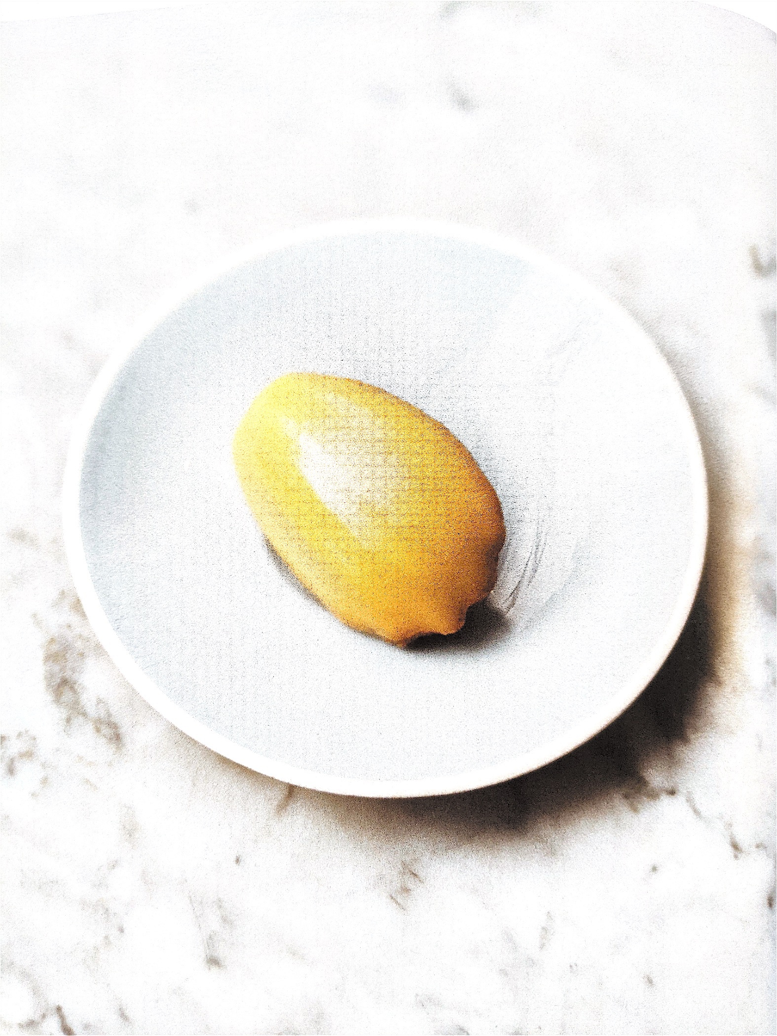 Madeleine with mango and lemon glaze