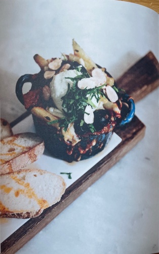 Baked eggs with chorizo, spiced tomato concasse & black olives