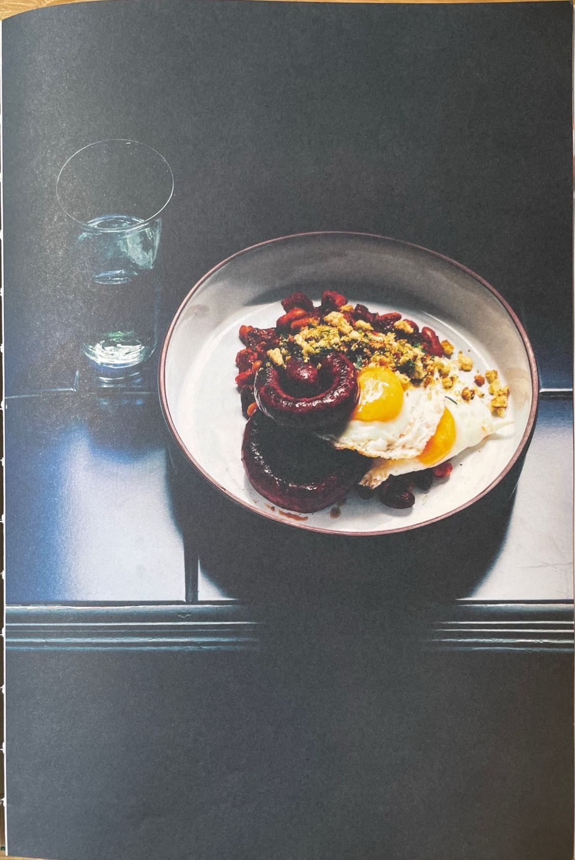 Spanish baked beans, merguez sausage, fried eggs & migas