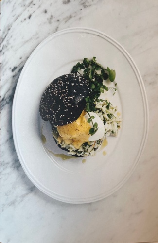 Lobster Benedict with citrus hollandaise & black brioche bun