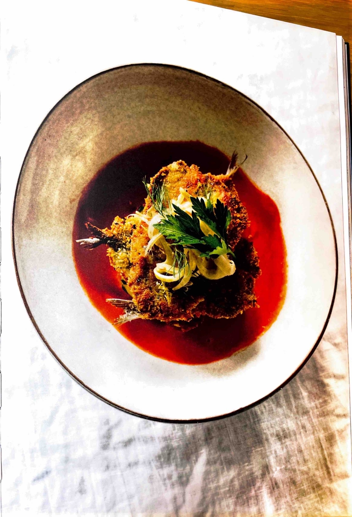 Crumbed sardine fillets, smoked tomato soup, kipfler potatoes